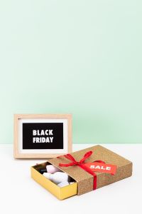 Kaboompics - Black Friday Sign and Gift Box with Large Mint Green Copy Space
