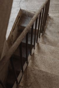 Kaboompics - Overhead Terrazzo Staircase with Dark Metal Railing