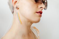 Kaboompics - Rainbow Face Paint on Woman's Cheek and Neck, Close-Up