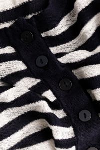 Kaboompics - Angled Button Placket on Black and White Striped Knit
