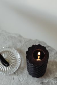 Kaboompics - Burning Black Candle and Palo Santo on Marble, Overhead Wellness Still Life