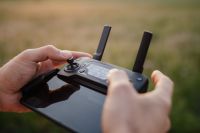 Kaboompics - Man holding remote controller for drones flying