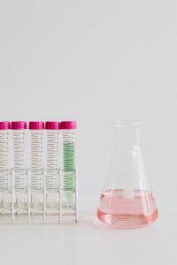 Kaboompics - Pink-Capped Test Tubes and Laboratory Flask