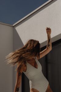 Kaboompics - Summer Swimwear Portrait against White Architecture and Blue Sky