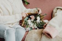 Kaboompics - Woman Arranging a Pastel Bouquet While Seated in a Cafe
