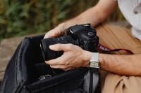 Kaboompics - Photographer holding a DSLR camera