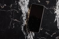 Kaboompics - Broken Mobile on Marble Table