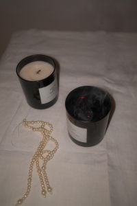 Kaboompics - Black Candles and Pearl Necklace on White Tablecloth