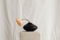 Kaboompics - Delicate Flower Arrangement with Folded White Textile