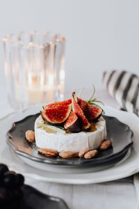 Kaboompics - Camembert and Figs with Glass Candleholder and Grapes in Frame