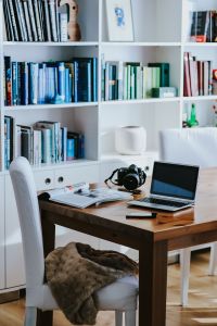 Kaboompics - Vertical Home Office Still Life with Laptop, Camera and Open Magazine