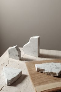 Kaboompics - Four Irregular Marble Pieces on Wood and Pale Stone