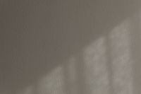 Kaboompics - Warm Taupe Plaster Texture with a Soft Pool of Light