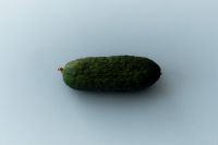 Kaboompics - Whole Cucumber on Blue Background