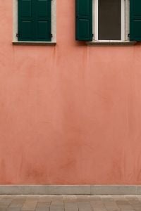 Kaboompics - Pink Building Facade with Green Shutters and Copy Space, Italy