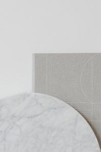 Kaboompics - White Marble Shelf and Gray Linen Texture for Minimalist Design Backgrounds