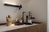 Kaboompics - Minimal Home Espresso Bar with Wood Cabinet and Black Wall Lamp