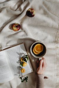 Kaboompics - Open Book and Tea on Cozy Beige Blanket