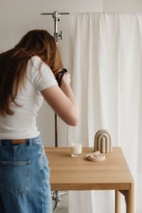Kaboompics - Behind the Scenes Young Photographer at Styled Tabletop Set