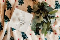 Kaboompics - Overhead White Gift Box with Eucalyptus on Christmas Blanket