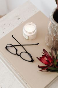 Kaboompics - Black Glasses, Candle and Red Dried Flowers