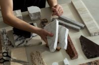Kaboompics - Hand Holding White Marble Tile in a Material Swatch Layout