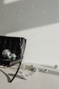 Kaboompics - Black Lounge Chair, Disco Balls and Broad White Copy Space
