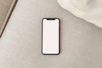 Kaboompics - Upright Blank Phone Mockup Against a Beige Sofa