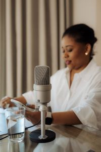 Kaboompics - Black Woman Behind a Podcast Microphone