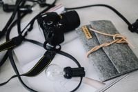 Kaboompics - Black camera with a grey wallet