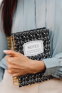 Kaboompics - Close-Up of a Notes Notebook Held by an Asian Woman
