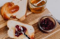 Kaboompics - Challah Toast With Raspberry Jam Beside Honey Jar