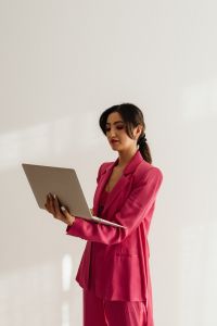 Kaboompics - Fashion Businesswoman with Laptop in Minimal Studio