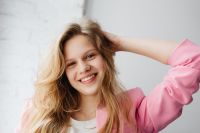 Kaboompics - Close-Up Blonde Fashion Portrait with Hand in Hair and Pink Blazer