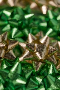 Kaboompics - Gold and Green Christmas Gift Bows Close Up