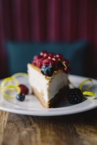 Kaboompics - Close-Up Berry Cheesecake Slice with Fork and Fresh Berries