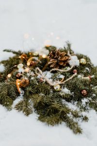 Kaboompics - Snow-Covered Christmas Wreath With Forest-Inspired Details
