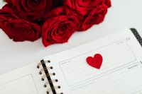 Kaboompics - Red Rose Bouquet, Open Planner and Felt Heart on White Desk