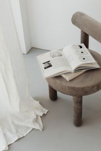 Kaboompics - Empty Beige Upholstered Armchair against White Wall with Copy Space