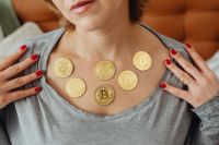 Kaboompics - Bitcoin Coins on Woman's Chest