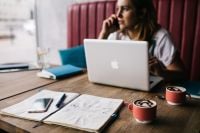 Kaboompics - Young woman working in a cafe