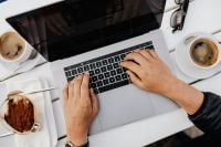 Kaboompics - Overhead Laptop, Coffee Cups and Tiramisu on a White Table