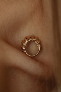 Kaboompics - Circular Gold Jewelry Macro on Skin