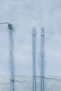 Kaboompics - Pale Blue Wall with Pipes and Overhead Wire