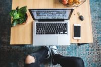 Kaboompics - Laptop Desk Setup with Phone, Houseplant and Fruit Bowl