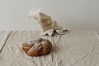 Kaboompics - Bread Loaf Under a Checkered Cloth