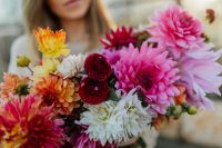 Kaboompics - Vibrant Dahlia Bouquet In Woman's Arms