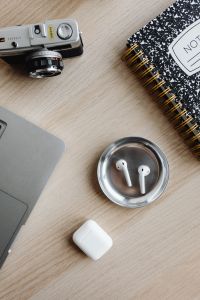 Kaboompics - Top View of Laptop, Camera, Notebook and AirPods