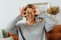 Kaboompics - Woman Covering Eyes With Bitcoin Coins