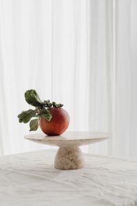Kaboompics - Red Apple with Dried Leaves on a Stone Pedestal, Minimal Fruit Styling for Food Backgrounds